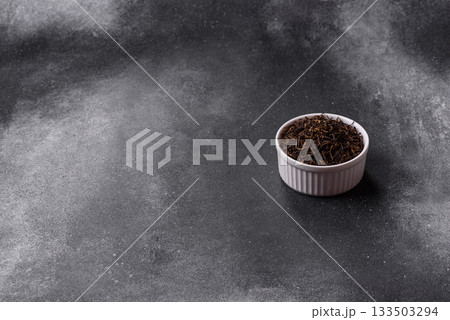 Golden black tea, dried leaves of a Chinese or Indian breakfast drink. Black tea dried leaves Golden black tea, dried leaves of a Chinese or Indian breakfast drink. Black tea dried leaves 133503294