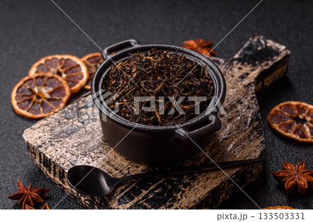 Golden black tea, dried leaves of a Chinese or Indian breakfast drink. Black tea dried leaves Golden black tea, dried leaves of a Chinese or Indian breakfast drink. Black tea dried leaves 133503331