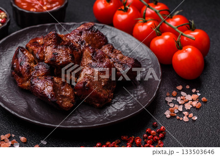 Beef, grilled meat in pieces, or kebab with sauce and vegetables. Beef in pieces Beef, grilled meat in pieces, or kebab with sauce and vegetables. Beef in pieces 133503646