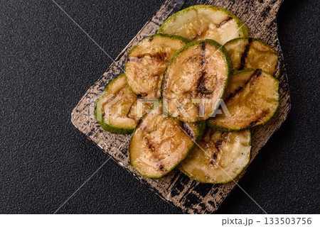 Grilled green zucchini slices, vegetarian food. Green barbecue zucchini 133503756