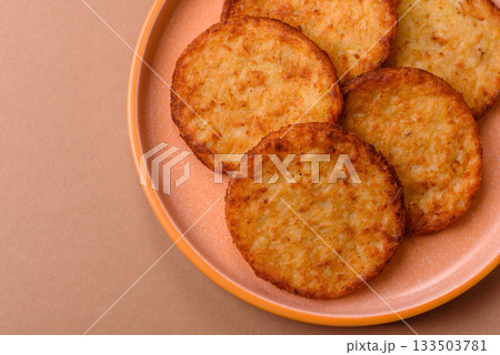 Potato hash browns, a cooked vegetable breakfast food. Potato hash brown Potato hash browns, a cooked vegetable breakfast food. Potato hash brown 133503781