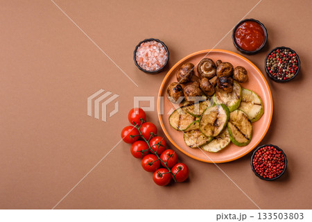 Grilled green zucchini slices, vegetarian food. Green barbecue zucchini Grilled green zucchini slices, vegetarian food. Green barbecue zucchini 133503803