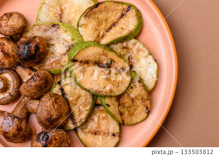 Grilled green zucchini slices, vegetarian food. Green barbecue zucchini Grilled green zucchini slices, vegetarian food. Green barbecue zucchini 133503812