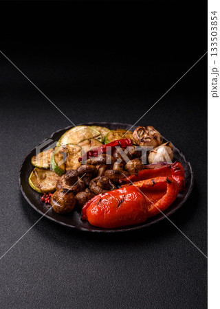 Grilled vegetables, bell peppers, mushrooms, and zucchini, a vegetarian meal. Grilled vegetables 133503854