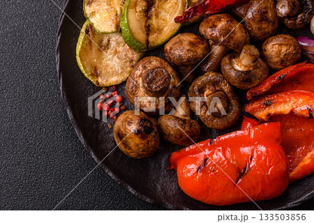 Grilled vegetables, bell peppers, mushrooms, and zucchini, a vegetarian meal. Grilled vegetables Grilled vegetables, bell peppers, mushrooms, and zucchini, a vegetarian meal. Grilled vegetables 133503856