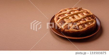 Sweet American pie with apples, pears, and cinnamon, a homemade dessert. Apple American pie 133503875