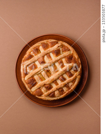 Sweet American pie with apples, pears, and cinnamon, a homemade dessert. Apple American pie Sweet American pie with apples, pears, and cinnamon, a homemade dessert. Apple American pie 133503877