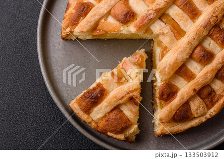 Sweet American pie with apples, pears, and cinnamon, a homemade dessert. Apple American pie 133503912