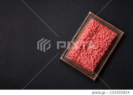 Raw ground beef for a burger or as an ingredient in a meat dish. Raw ground beef 133503924