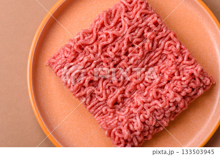 Raw ground beef for a burger or as an ingredient in a meat dish. Raw ground beef Raw ground beef for a burger or as an ingredient in a meat dish. Raw ground beef 133503945