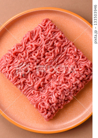 Raw ground beef for a burger or as an ingredient in a meat dish. Raw ground beef 133503946