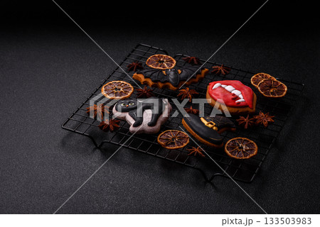 Halloween cookies, sweets, or gingerbread, a cat, a bat, and a hat. Halloween gingerbread 133503983