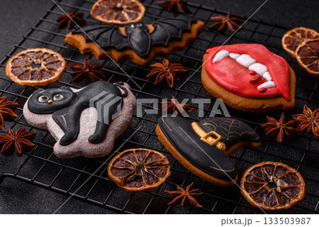 Halloween cookies, sweets, or gingerbread, a cat, a bat, and a hat. Halloween gingerbread 133503987