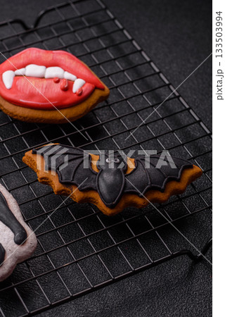 Halloween cookies, sweets, or gingerbread, a cat, a bat, and a hat. Halloween gingerbread 133503994