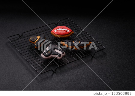 Halloween cookies, sweets, or gingerbread, a cat, a bat, and a hat. Halloween gingerbread 133503995