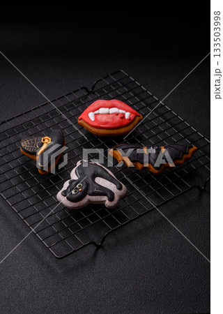 Halloween cookies, sweets, or gingerbread, a cat, a bat, and a hat. Halloween gingerbread 133503998