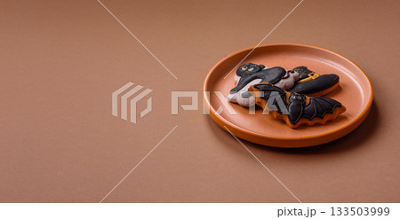 Halloween cookies, sweets, or gingerbread, a cat, a bat, and a hat. Halloween gingerbread Halloween cookies, sweets, or gingerbread, a cat, a bat, and a hat. Halloween gingerbread 133503999