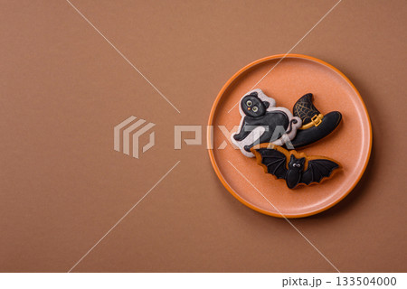 Halloween cookies, sweets, or gingerbread, a cat, a bat, and a hat. Halloween gingerbread Halloween cookies, sweets, or gingerbread, a cat, a bat, and a hat. Halloween gingerbread 133504000