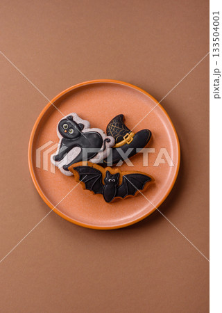 Halloween cookies, sweets, or gingerbread, a cat, a bat, and a hat. Halloween gingerbread 133504001