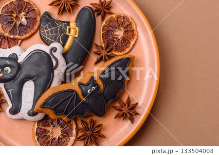 Halloween cookies, sweets, or gingerbread, a cat, a bat, and a hat. Halloween gingerbread 133504008