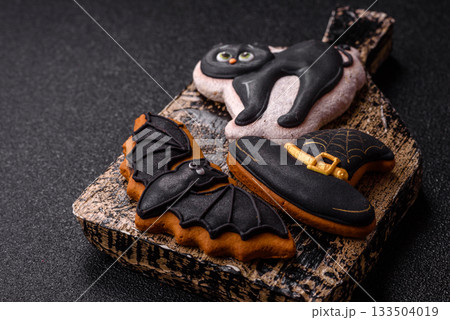 Halloween cookies, sweets, or gingerbread, a cat, a bat, and a hat. Halloween gingerbread 133504019