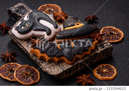 Halloween cookies, sweets, or gingerbread, a cat, a bat, and a hat. Halloween gingerbread 133504023