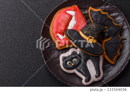 Halloween cookies, sweets, or gingerbread, a cat, a bat, and a hat. Halloween gingerbread Halloween cookies, sweets, or gingerbread, a cat, a bat, and a hat. Halloween gingerbread 133504036
