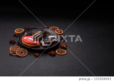 Halloween cookies, sweets, or gingerbread, a cat, a bat, and a hat. Halloween gingerbread Halloween cookies, sweets, or gingerbread, a cat, a bat, and a hat. Halloween gingerbread 133504043