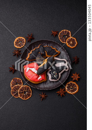 Halloween cookies, sweets, or gingerbread, a cat, a bat, and a hat. Halloween gingerbread 133504045