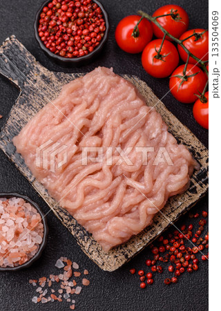 Raw minced chicken for a burger or as an ingredient in a meat dish. Raw ground chicken 133504069
