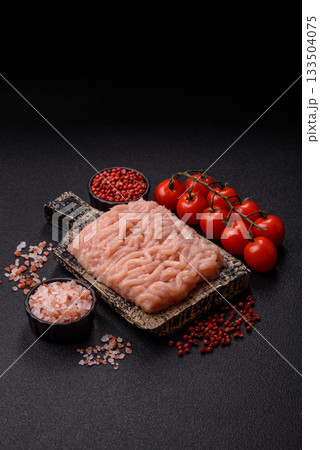 Raw minced chicken for a burger or as an ingredient in a meat dish. Raw ground chicken 133504075
