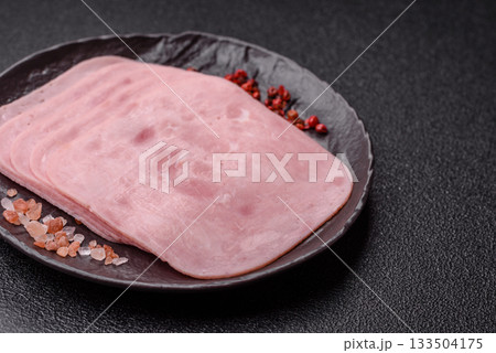Meat, square ham sliced, organic food, protein for snacks. Sliced ham as a background Meat, square ham sliced, organic food, protein for snacks. Sliced ham as a background 133504175