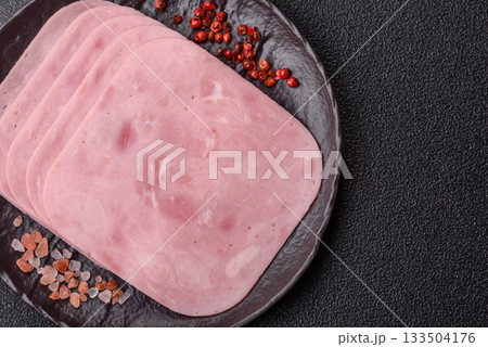 Meat, square ham sliced, organic food, protein for snacks. Sliced ham as a background 133504176