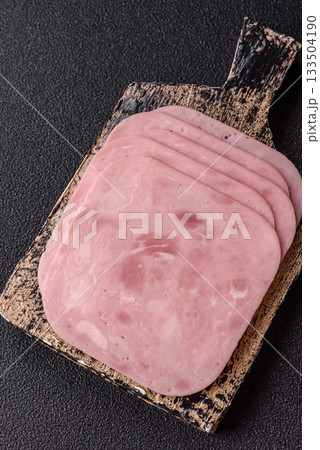 Meat, square ham sliced, organic food, protein for snacks. Sliced ham as a background 133504190