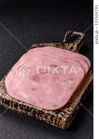 Meat, square ham sliced, organic food, protein for snacks. Sliced ham as a background 133504191