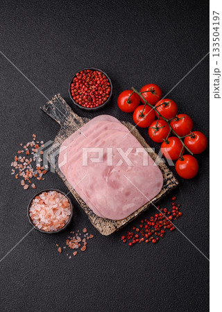 Meat, square ham sliced, organic food, protein for snacks. Sliced ham as a background Meat, square ham sliced, organic food, protein for snacks. Sliced ham as a background 133504197