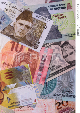 Paper money, banknotes of different countries as a business background. Paper money and cash 133504224
