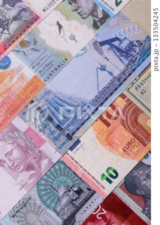 Paper money, banknotes of different countries as a business background. Paper money and cash Paper money, banknotes of different countries as a business background. Paper money and cash 133504245