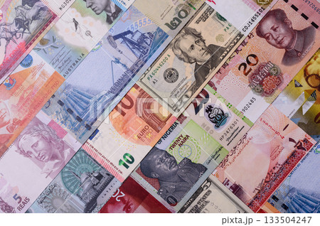 Paper money, banknotes of different countries as a business background. Paper money and cash Paper money, banknotes of different countries as a business background. Paper money and cash 133504247