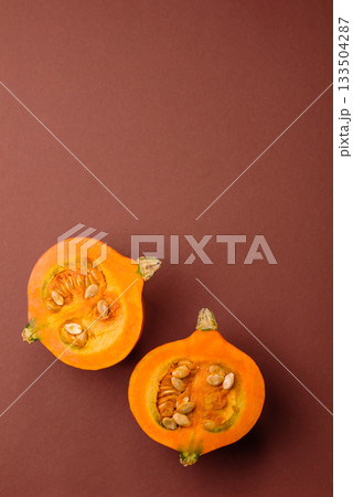 Half a raw pumpkin, a ripe orange colored butternut squash. Raw pumpkin Half a raw pumpkin, a ripe orange colored butternut squash. Raw pumpkin 133504287