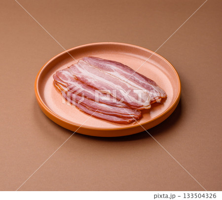 Meat, raw pork bacon sliced, organic food, protein for snacks. Raw bacon as a background 133504326