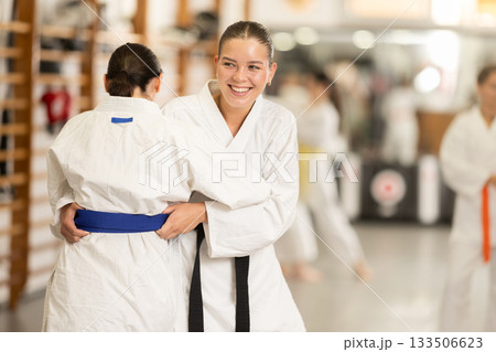 Women athletes in pair conduct training battle in oriental fighting technique judo 133506623