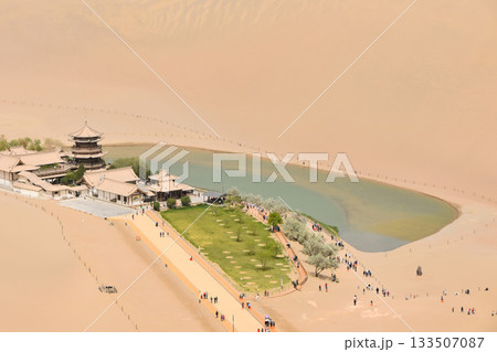 Crescent Moon Lake an the Singing Sand Dunes at Dunhuang in China 133507087