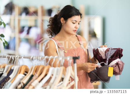 Girl at trading floor pick out and buying bra 133507115