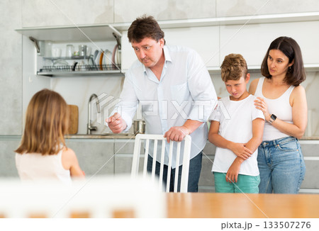 Parents scold their daughter in kitchen at home Parents scold their daughter in kitchen at home 133507276