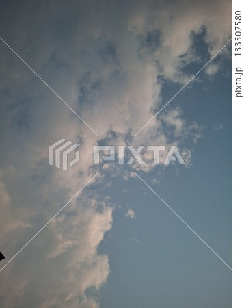 Blue Sky With White Clouds Over Calm Horizon, Peaceful Natural Scene 133507580