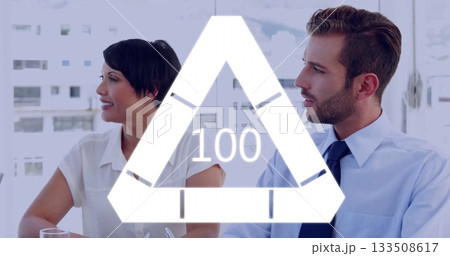 Meeting colleagues in business wear in meeting room at table by windows with triangular 100 overlay Meeting colleagues in business wear in meeting room at table by windows with triangular 100 overlay 133508617