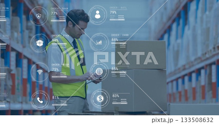 Operating scanner, worker in neon vest scanning pallet boxes at warehouse with digital overlays Operating scanner, worker in neon vest scanning pallet boxes at warehouse with digital overlays 133508632