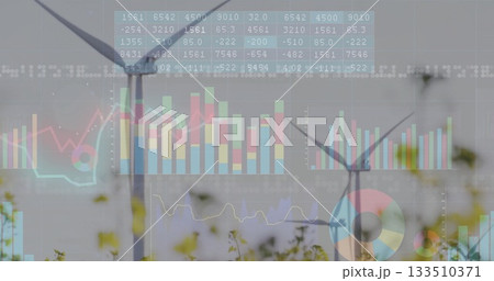 Displaying two wind turbines rising between tall grass at wind farm, with financial chart overlays 133510371