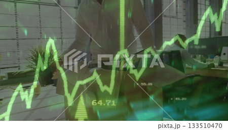 Leaning man in white shirt adjusting architectural model at office, with financial chart overlay Leaning man in white shirt adjusting architectural model at office, with financial chart overlay 133510470